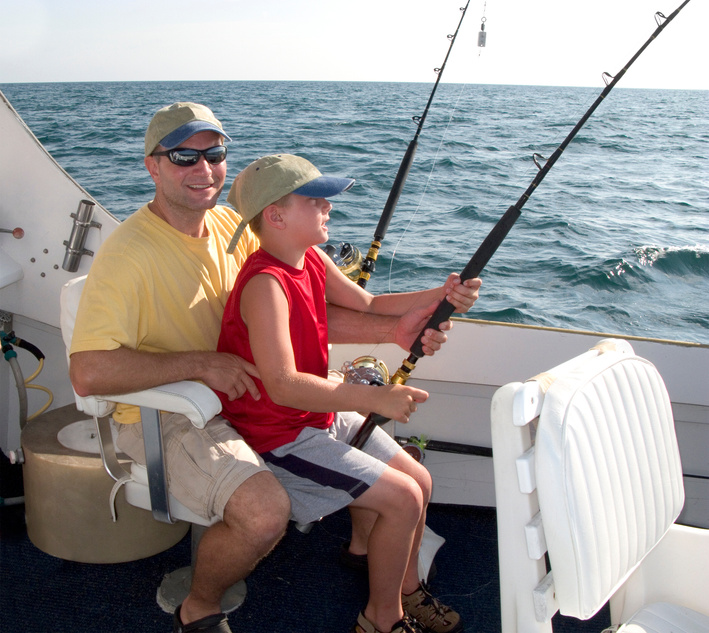 Father & Son (boy) On Charter Fishing Boat